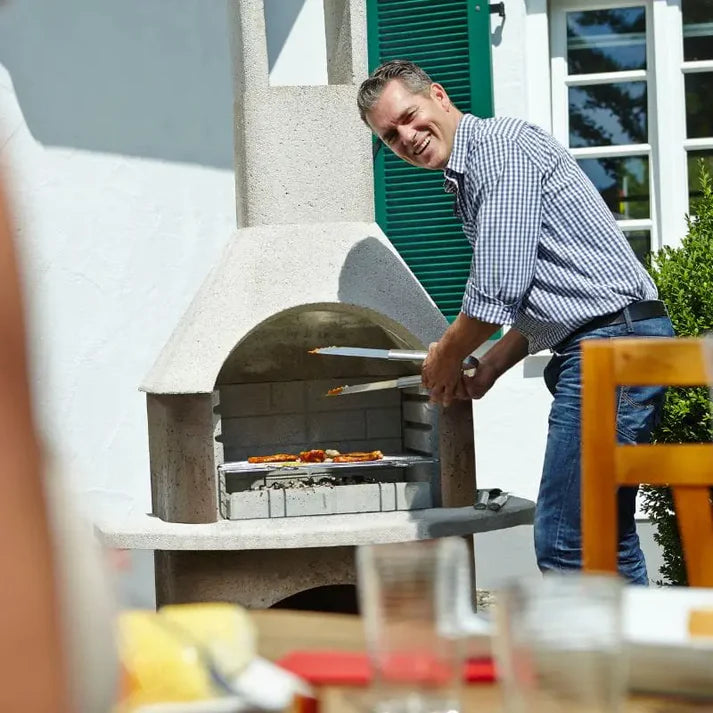 Buschbeck Milano masonry barbecue with base in garden setting