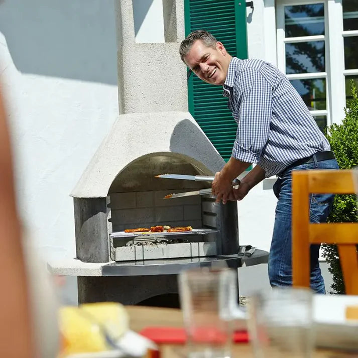 Buschbeck Stockholm masonry barbecue with base in garden setting