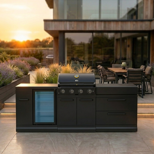 GRLLR Connect Outdoor Kitchen – G4S 4-Burner BBQ with grill and refrigerator in a modern backyard setting during sunset.