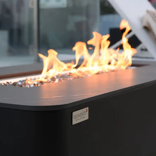 Fire pit table with flames on a patio setting