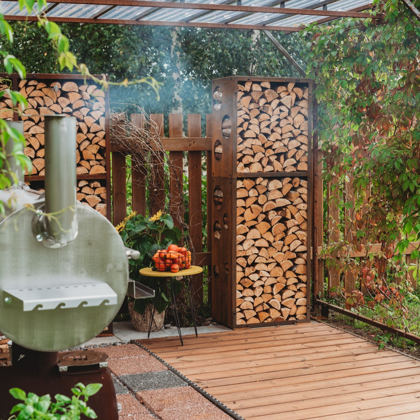 WoodStock L firewood rack used as a garden dividers