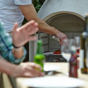 Buschbeck Rondo masonry barbecue in garden setting