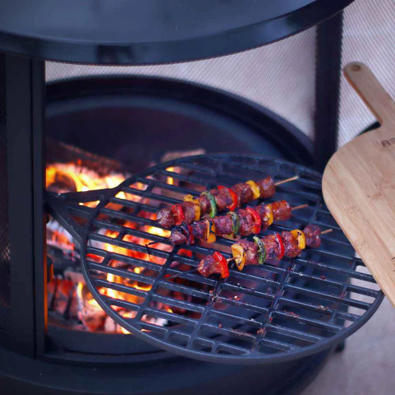 Cast iron fire pit with swing-out BBQ grill for outdoor cooking