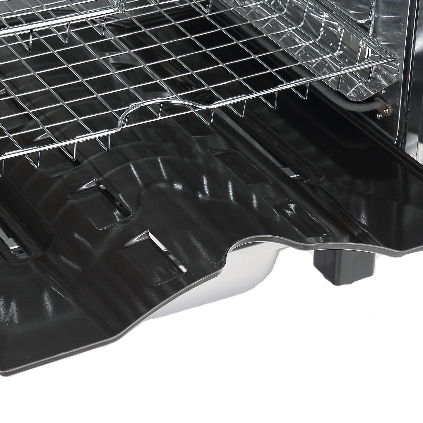 Open oven with racks and a black interior lining.