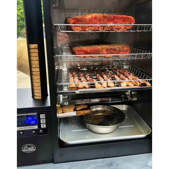 Smoker with racks of food inside, including ribs and chicken on a sunny day