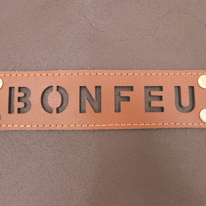 Brown leather patch with 'BONFEU' text on a brown background