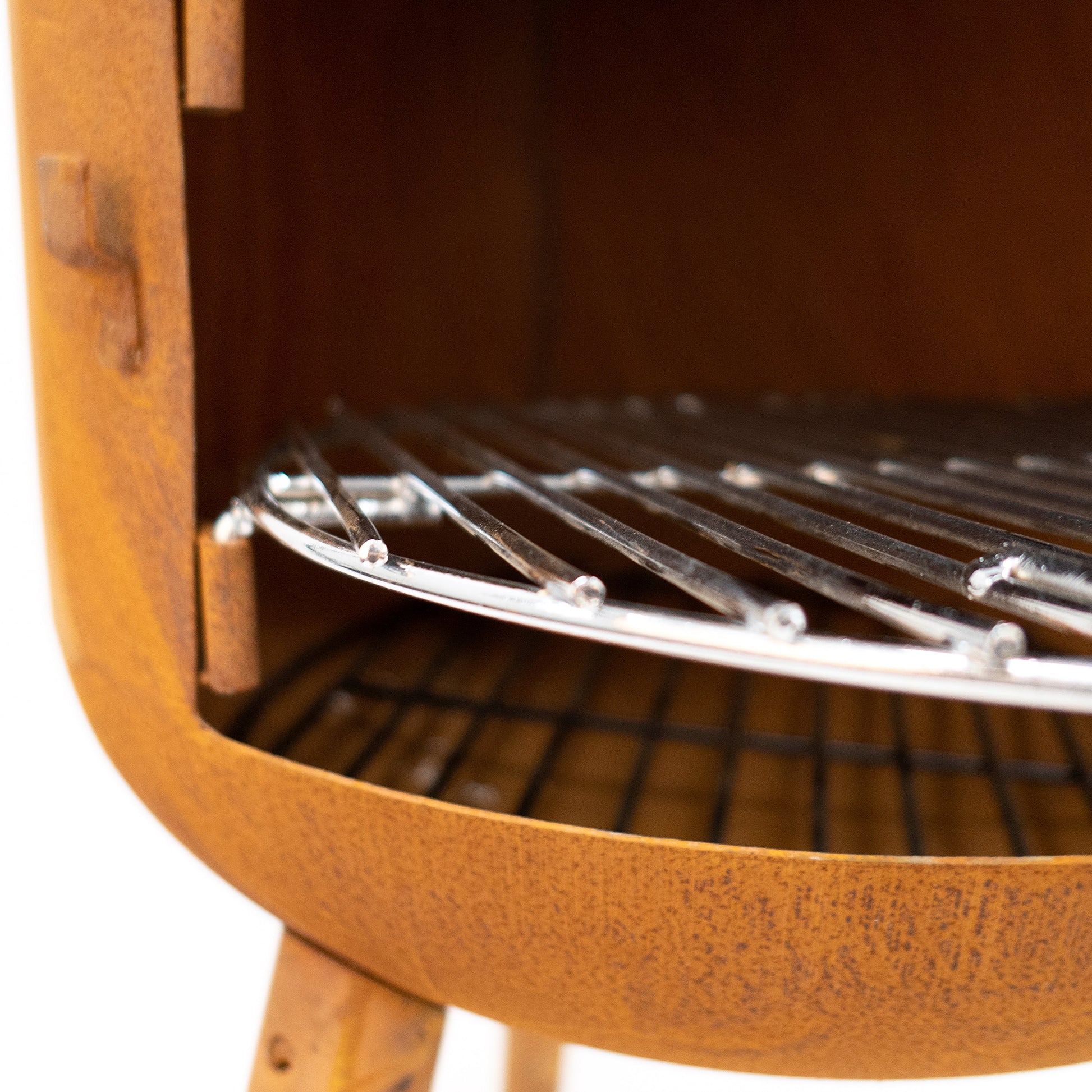 Wooden barbecue grill with metal grate on a white background