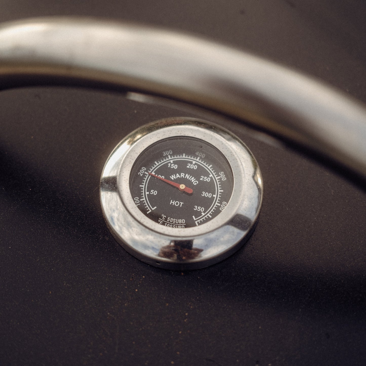 Temperature gauge on a dark surface