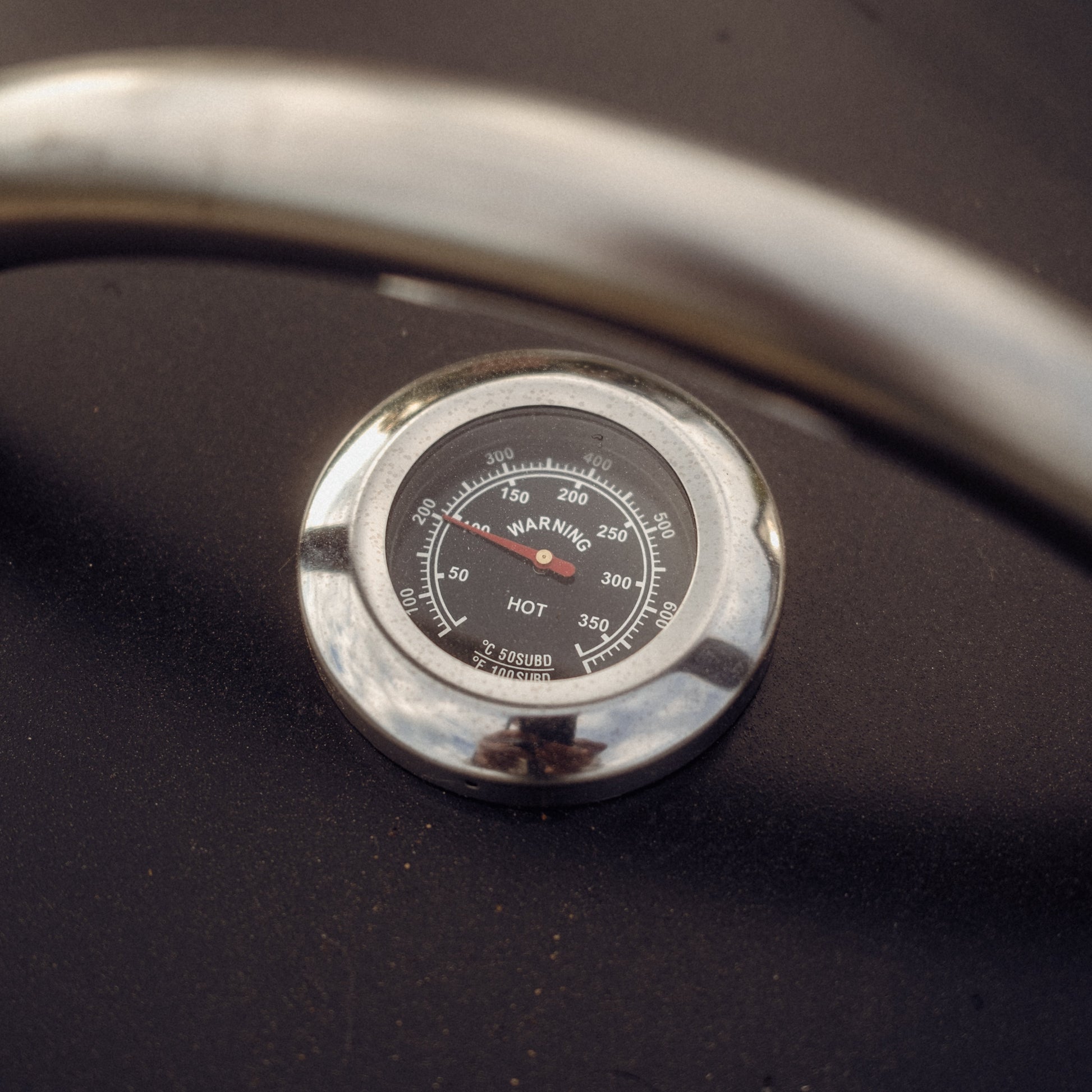 Temperature gauge on a dark surface