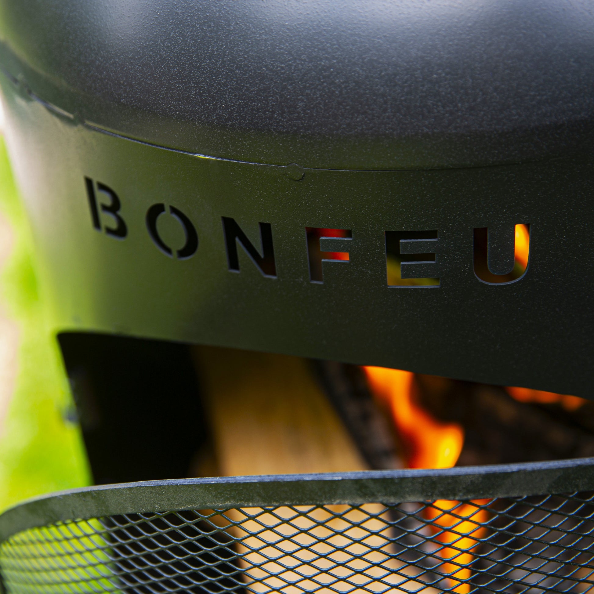 Bonfeu fire pit with flames visible, brand name on top