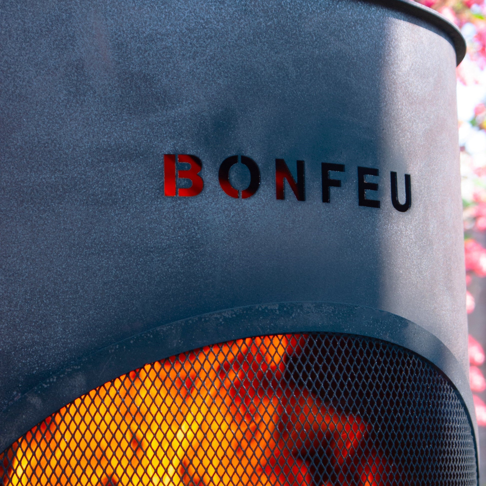 Bonfeu fire pit with flames visible, featuring the brand name.