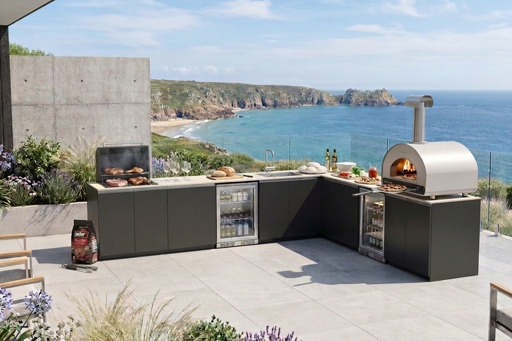 Premium outdoor entertaining kitchen with live-fire charcoal grill, pizza oven and refrigeration in a contemporary coastal garden