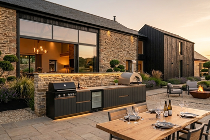 Fontana Ignes Family outdoor kitchen with 4 burner gas BBQ, dual fuel pizza oven, integrated sink, outdoor fridge and storage in a contemporary UK garden