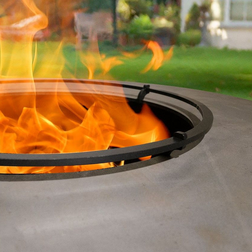Fire pit with flames on a patio