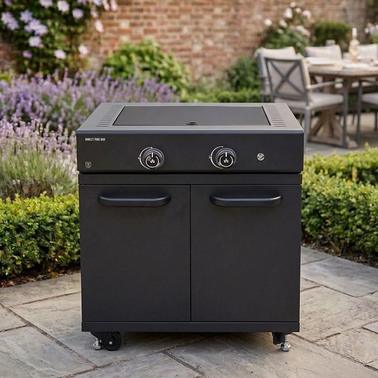 GRLLR Black outdoor grill on a patio with garden and table in the background