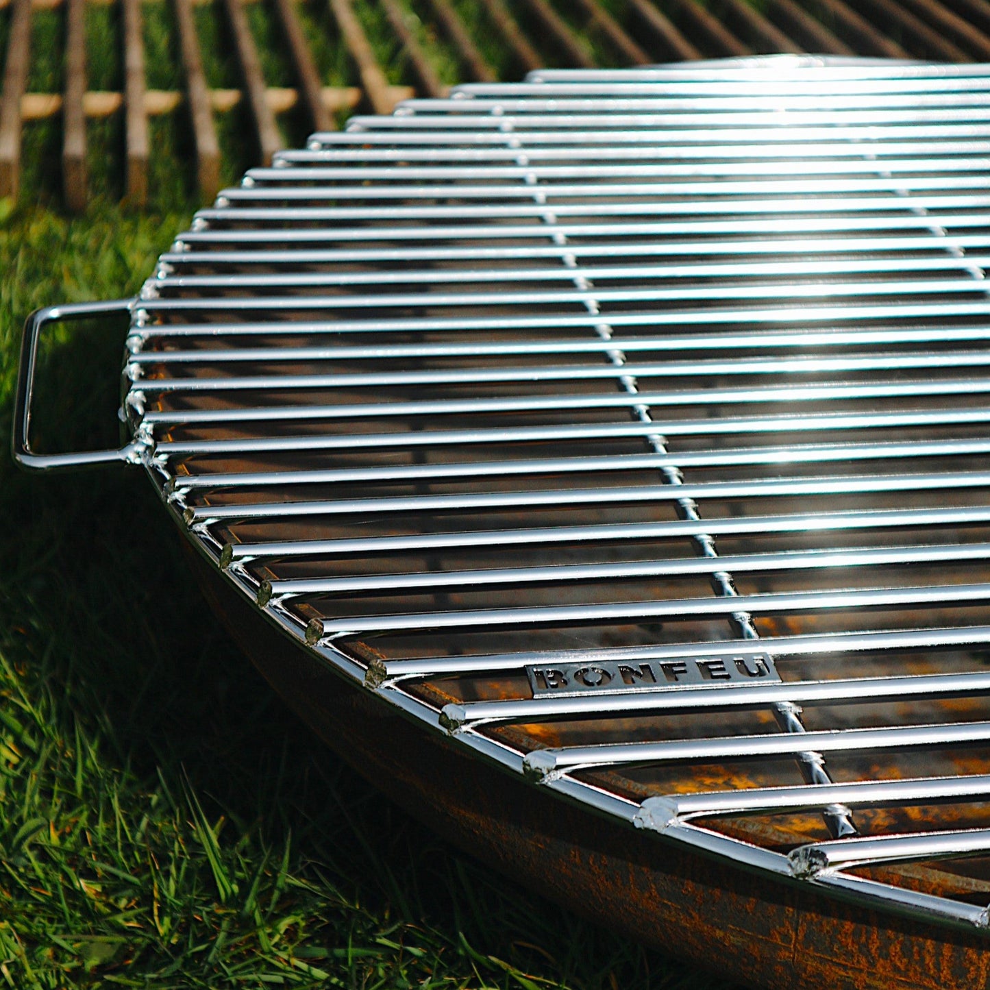 Barbecue grill on grass with a blurred background