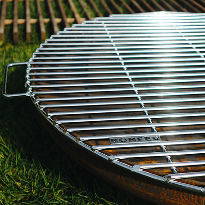Barbecue grill on grass with a blurred background