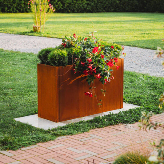 Grillsymbol Rectangular metal planter with plants on a grassy area