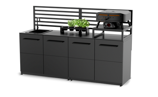 Cozze Black outdoor kitchen island with drawers, sink, and small appliances on a white background