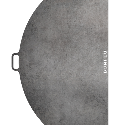 Black cast iron skillet with 'BONFEU' branding on a white background