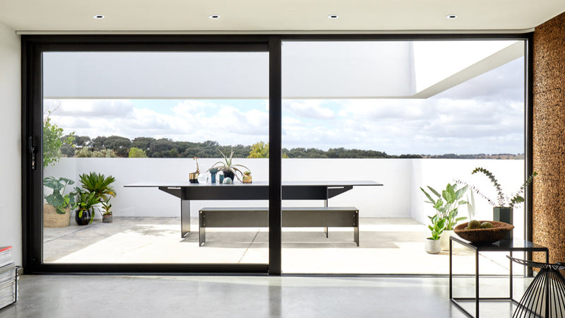 RIVA garden table and bench by conmoto in minimalist HPL design for modern outdoor dining